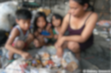 Children with a food vendor